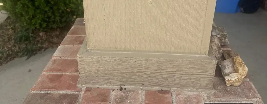 After: porch column rot repair. Rotted column base cut out, rebuilt and painted to match.